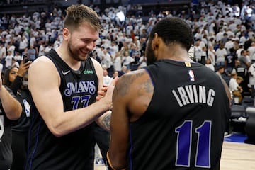 Luka Doncic #77 celebrates with Kyrie Irving #11of the Dallas Mavericks 